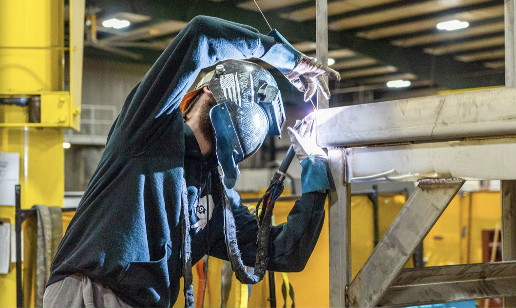 Business owner welding